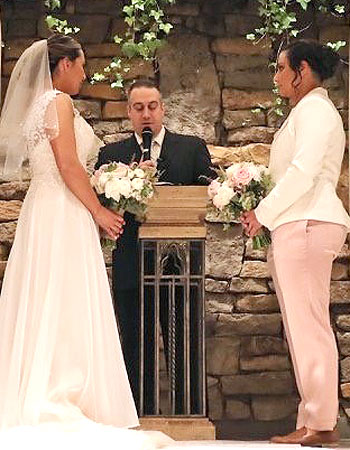 Wedding ceremony officiant Reverend Nick performaing a Long Island same-sex wedding ceremony